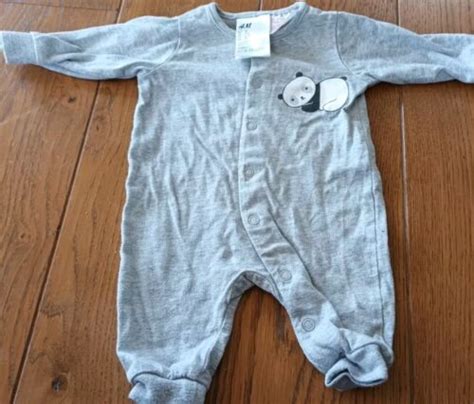 h&m baby sleepsuits.